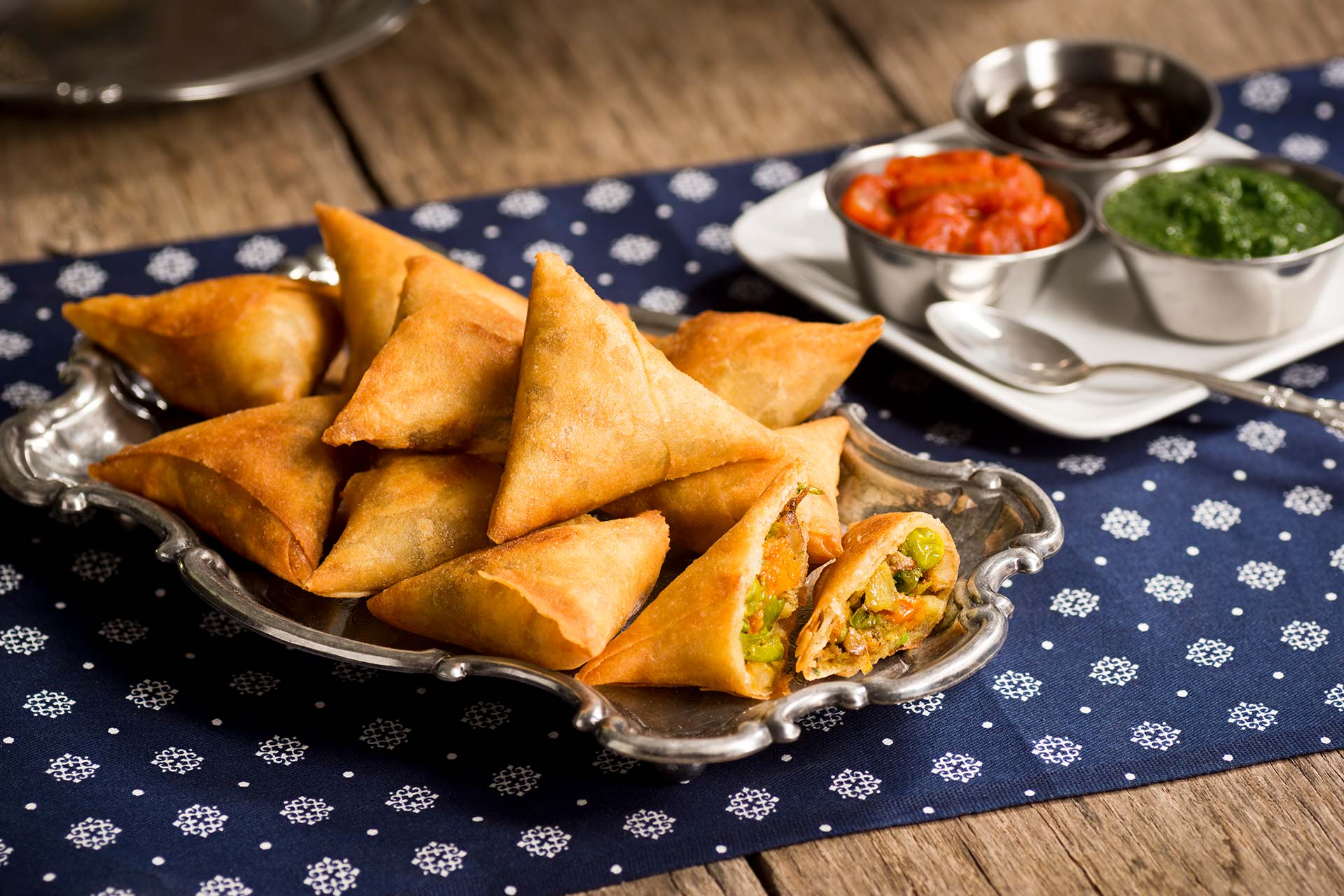 A dish of many samosas